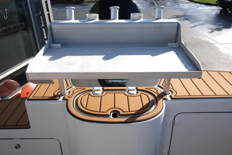 Slide: The Image of 2023 Makaira Sportfish 800 boat deck with fishing station and rod holders. - 11