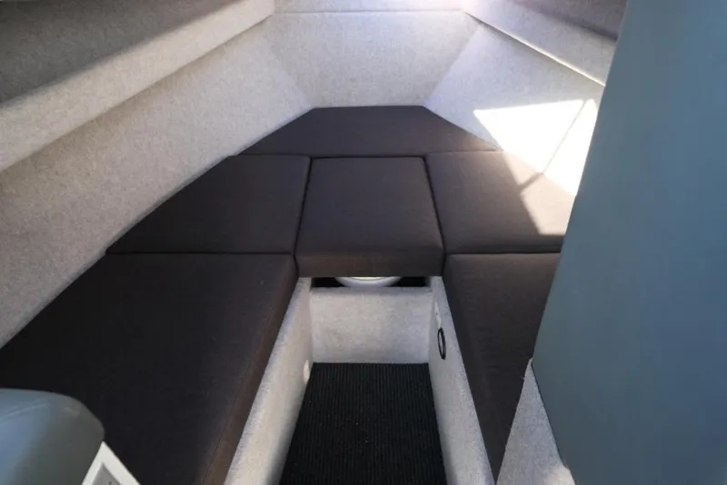 Slide: The Image of 2023 Makaira Sportfish 800 interior cabin with cushioned seating and modern design. - 18