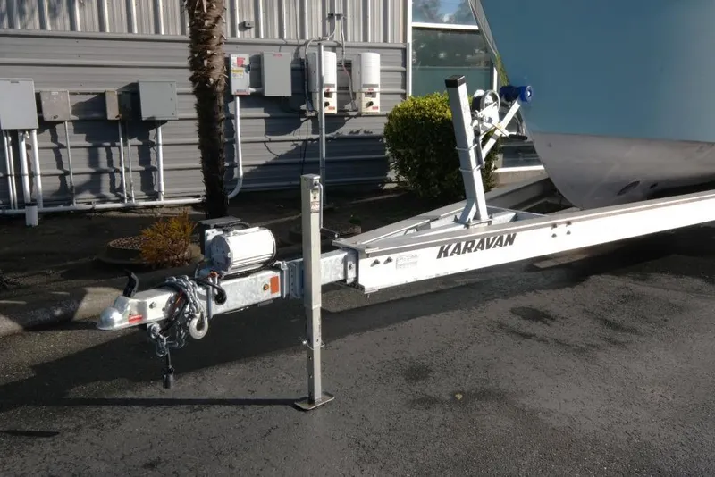 Slide: The Image of Trailer for 2023 Makaira Sportfish 800 boat, parked outdoors. - 23