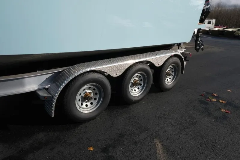 Slide: The Image of Trailer for 2023 Makaira Sportfish 800 boat with triple axle wheels. - 24
