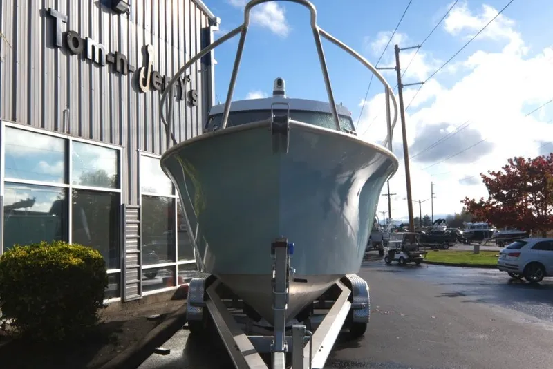 Slide: The Image of 2023 Makaira Sportfish 800 boat on trailer outside dealership. - 3