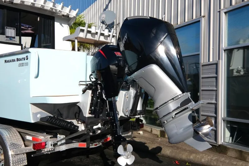 Slide: The Image of 2023 Makaira Sportfish 800 boat with powerful outboard motor on trailer. - 6