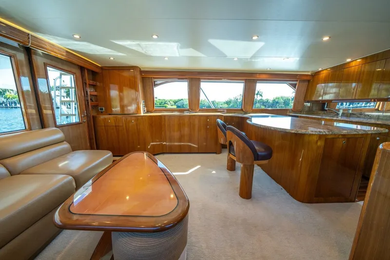 Slide: The Image of Luxurious interior of 2006 Viking 68 Convertible yacht with elegant wood finishes and plush seating. - 15