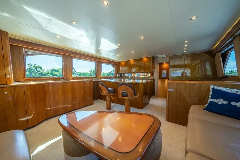Slide: The Image of Luxurious interior of 2006 Viking 68 Convertible yacht with polished wood and plush seating. - 16