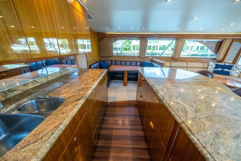 Slide: The Image of Luxurious interior of 2006 Viking 68 Convertible yacht with granite countertops and plush seating. - 20