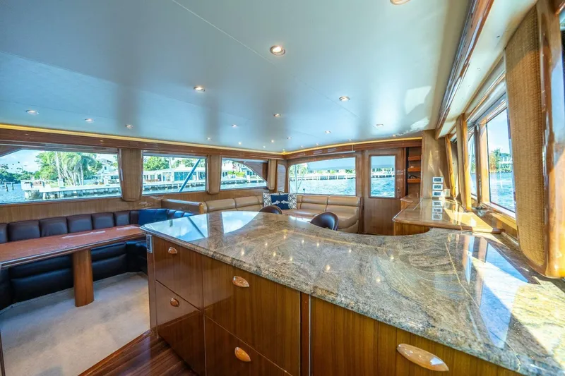 Slide: The Image of Luxurious interior of a 2006 Viking 68 Convertible yacht with elegant wood finishes. - 21