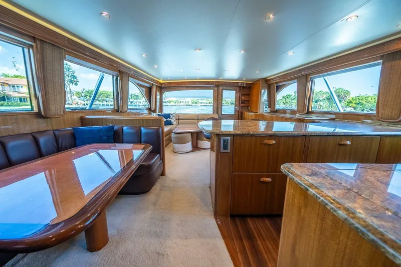 Slide: The Image of Luxurious interior of a 2006 Viking 68 Convertible yacht with elegant wood finishes. - 22