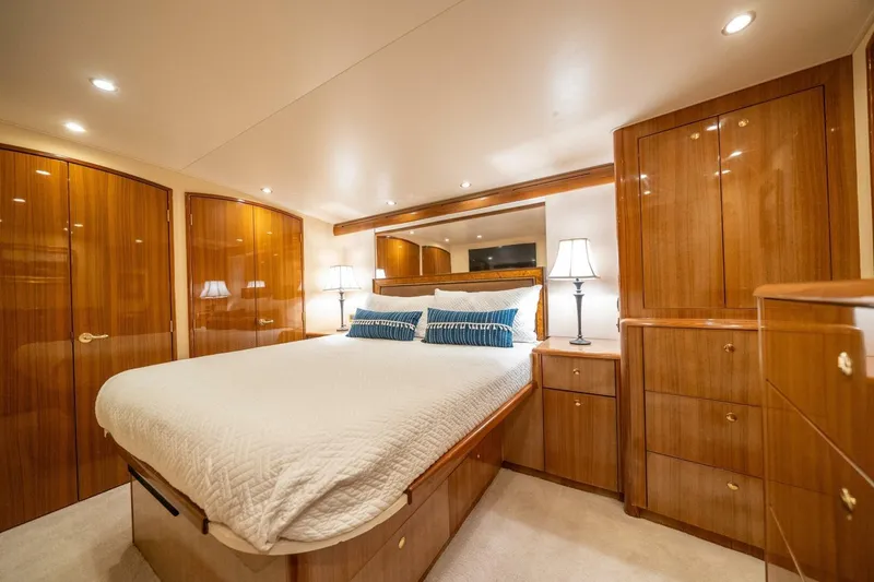 Slide: The Image of Luxurious bedroom interior of 2006 Viking 68 Convertible yacht with elegant wood finish. - 24