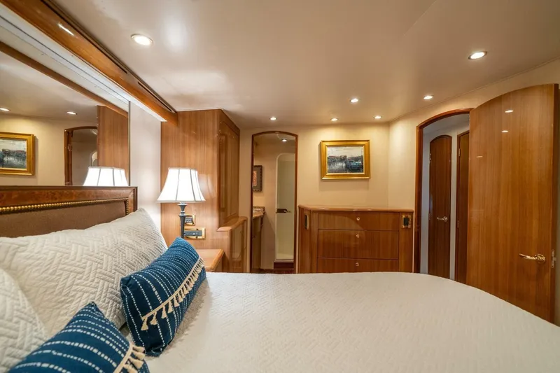 Slide: The Image of Luxurious bedroom interior of 2006 Viking 68 Convertible yacht with elegant wood finishes. - 27