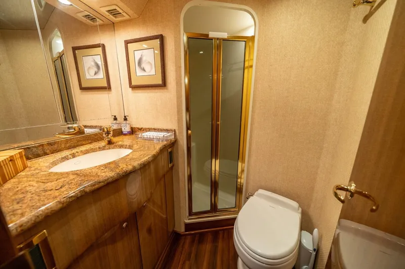 Slide: The Image of Luxurious bathroom in 2006 Viking 68 Convertible yacht with granite countertop and shower. - 34