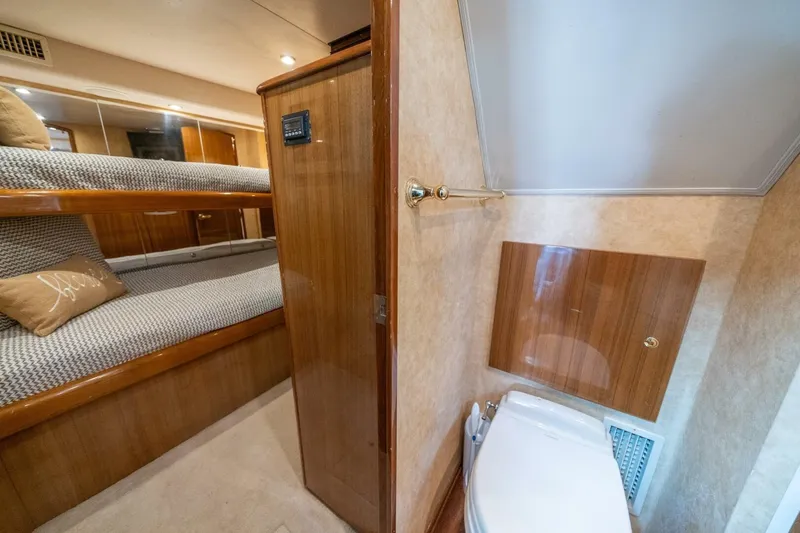 Slide: The Image of Interior of 2006 Viking 68 Convertible yacht with bunk beds and bathroom. - 37