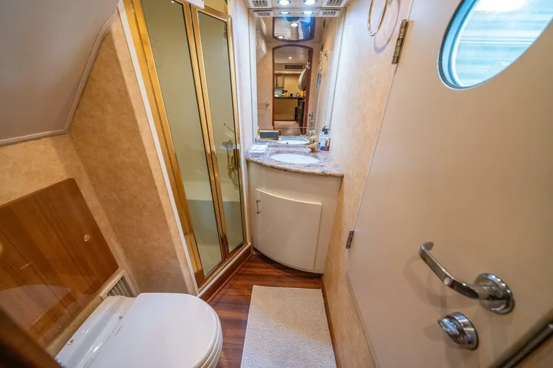 Slide: The Image of Luxurious bathroom in 2006 Viking 68 Convertible yacht with modern amenities and elegant design. - 39
