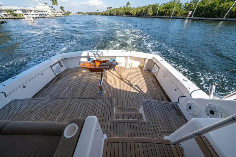 Slide: The Image of 2006 Viking 68 Convertible yacht deck with scenic waterway view. - 49