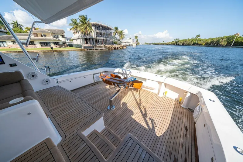 Slide: The Image of Luxurious 2006 Viking 68 Convertible yacht cruising on a scenic waterway. - 50