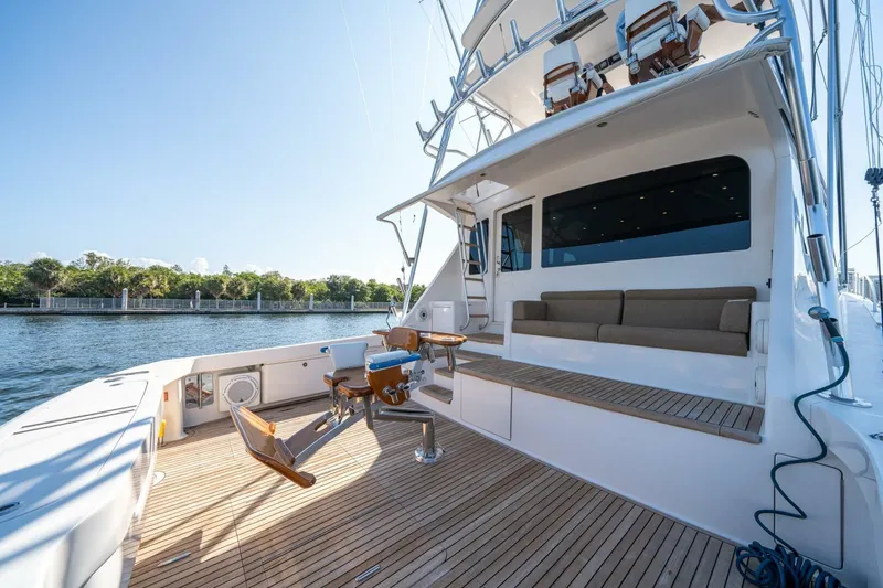 Slide: The Image of 2006 Viking 68 Convertible yacht deck with seating and fishing chairs. - 52