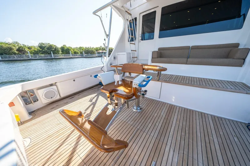Slide: The Image of 2006 Viking 68 Convertible yacht deck with fishing chair and seating area. - 53