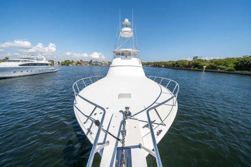 Slide: The Image of Front view of a 2006 Viking 68 Convertible yacht on a sunny day. - 59