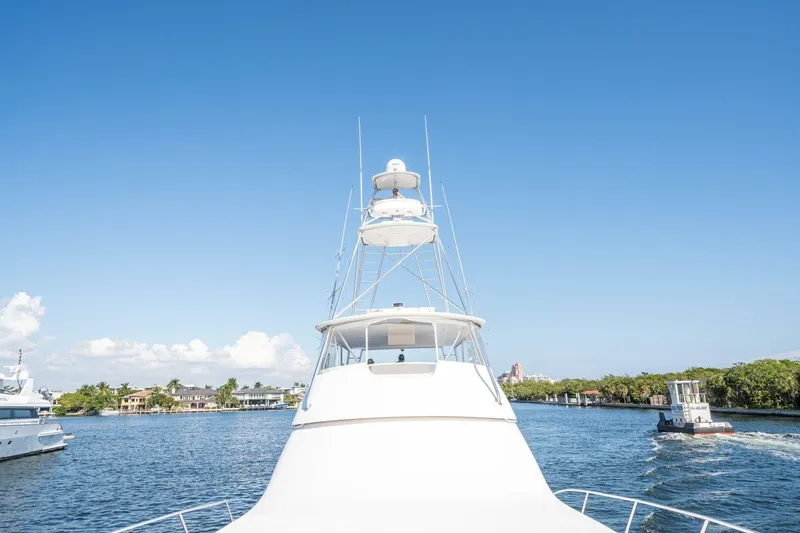 Slide: The Image of 2006 Viking 68 Convertible yacht cruising on a sunny day, clear blue sky. - 60