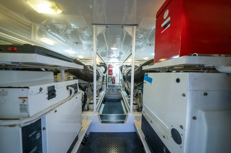 Slide: The Image of Engine room of 2006 Viking 68 Convertible yacht, featuring machinery and equipment. - 63