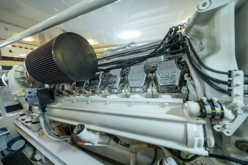 Slide: The Image of Engine room of 2006 Viking 68 Convertible yacht, showcasing detailed machinery components. - 68