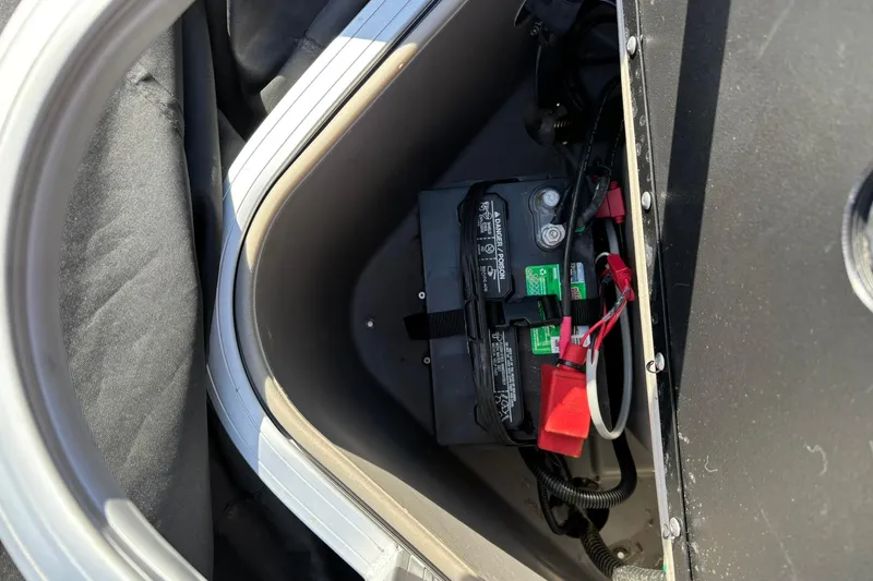 Slide: The Image of Battery compartment of 2023 Sun Tracker Fishin' Barge 20 DLX pontoon boat. - 15