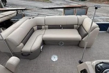 Slide: The Image of 2023 Sun Tracker Fishin' Barge 20 DLX with spacious seating and scenic outdoor view. - 16