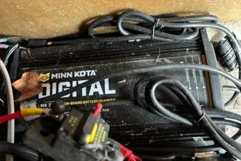 Slide: The Image of Minn Kota digital onboard battery charger in a 2023 Sun Tracker Fishin' Barge 20 DLX. - 19