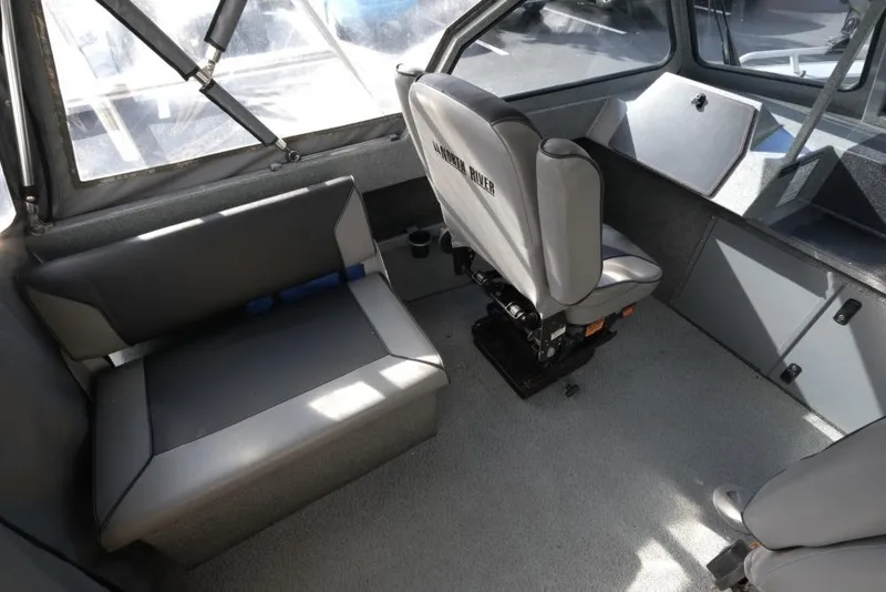 Slide: The Image of Interior of 2017 North River 21 SEAHAWK boat with seating and helm. - 12