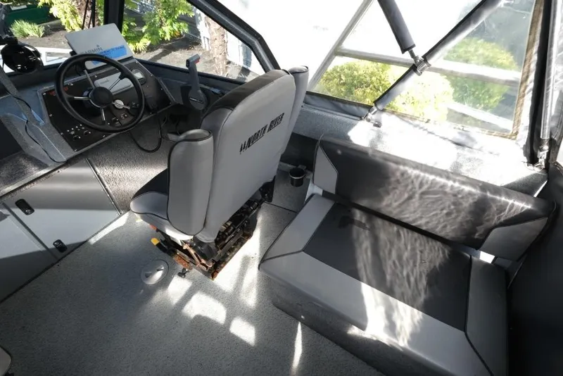 Slide: The Image of Interior of 2017 North River 21 SEAHAWK boat with steering wheel and seating. - 13