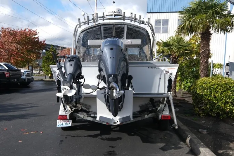 Slide: The Image of 2017 North River 21 SEAHAWK boat with dual outboard motors parked outdoors. - 5