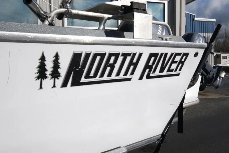 Slide: The Image of 2017 North River 21 SEAHAWK boat with logo and tree graphics. - 6