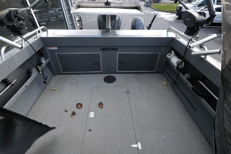 Slide: The Image of 2017 North River 21 SEAHAWK boat interior with fishing equipment and storage compartments. - 8