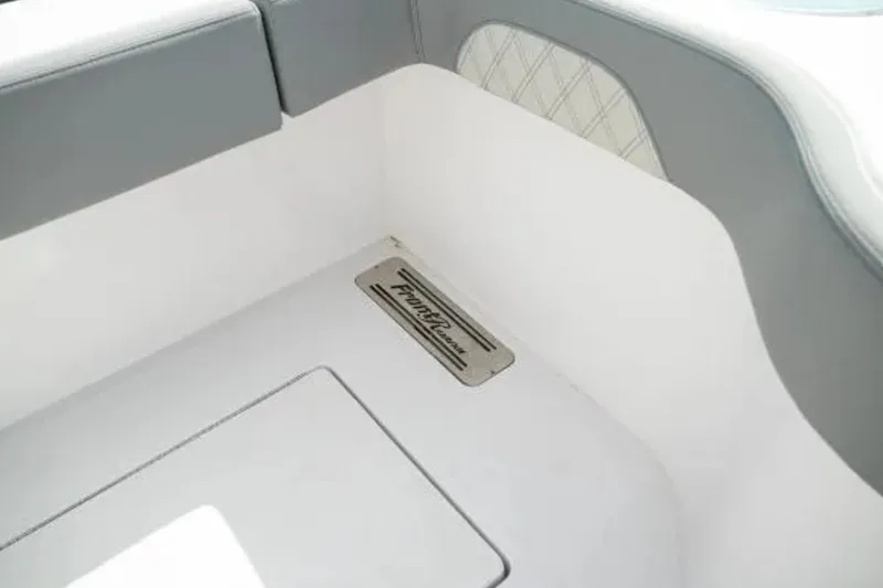 Slide: The Image of 2024 Front Runner 37 Catamaran interior detail with logo and seating. - 106