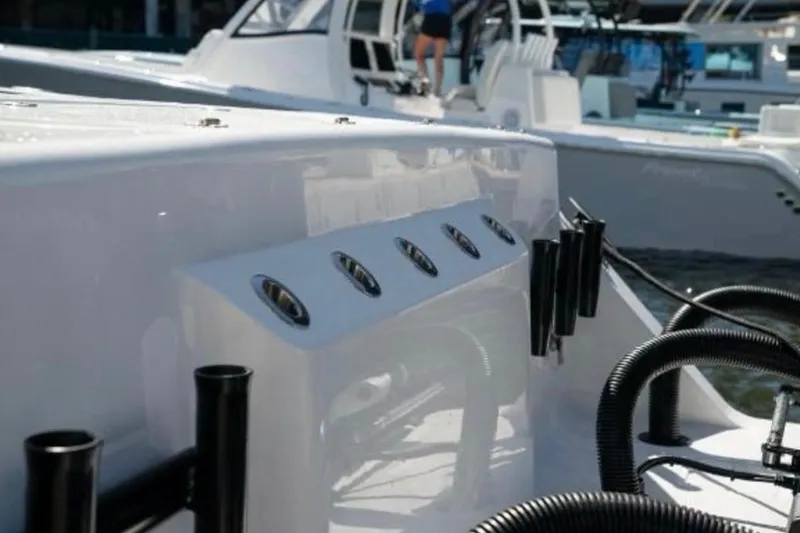 Slide: The Image of 2024 Front Runner 37 Catamaran, sleek design with rod holders and modern features. - 107