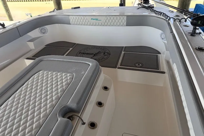 Slide: The Image of 2024 Front Runner 37 Catamaran cruising on open water, rear view. - 13