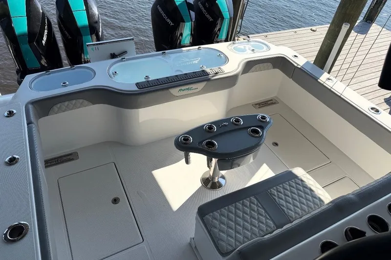 Slide: The Image of 2024 Front Runner 37 Catamaran cruising on open water near a bridge. - 14