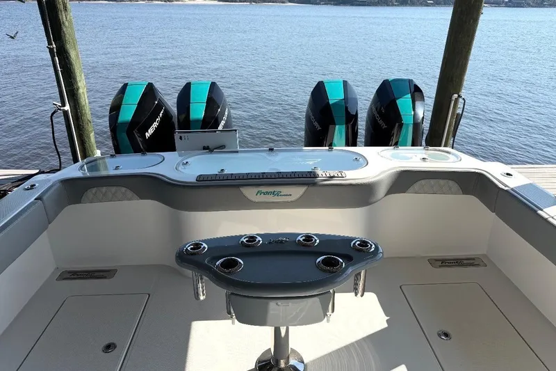 Slide: The Image of 2024 Front Runner 37 Catamaran cruising on a sunny day near a bridge and port. - 15