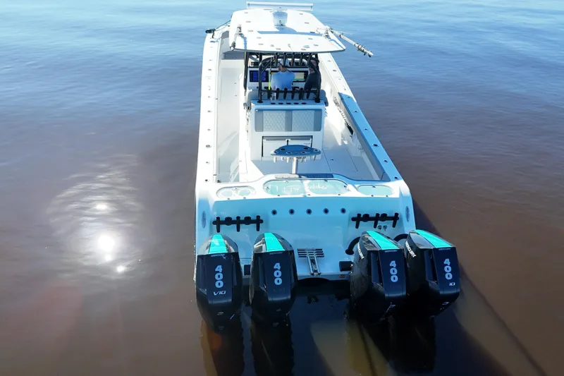 Slide: The Image of 2024 Front Runner 37 Catamaran with quad 400 horsepower engines on calm water. - 43