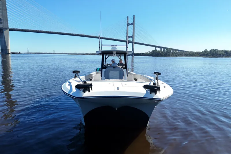 Slide: The Image of 2024 Front Runner 37 Catamaran on water near a bridge, clear sky. - 49