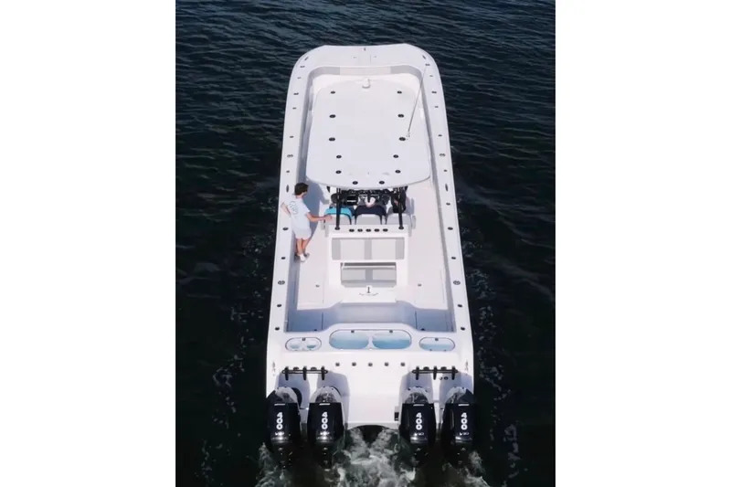 Slide: The Image of 2024 Front Runner 37 Catamaran cruising on a sunny day with dual Mercury engines. - 6