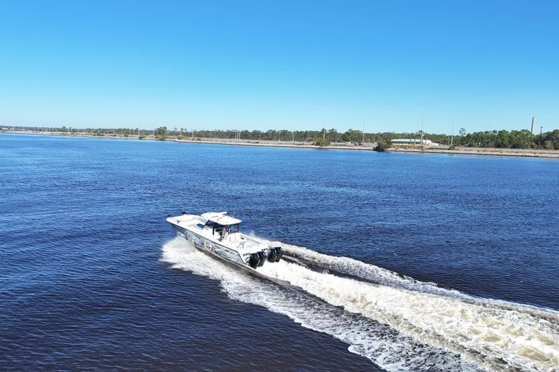 Slide: The Image of 2024 Front Runner 37 Catamaran cruising on a sunny day in open water. - 62