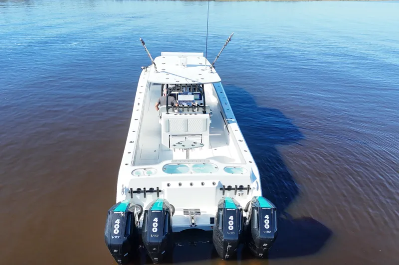 Slide: The Image of 2024 Front Runner 37 Catamaran with quad 400 V10 engines on calm water. - 65