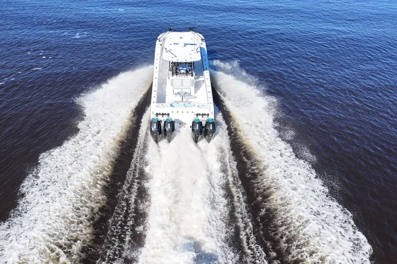 Slide: The Image of 2024 Front Runner 37 Catamaran cruising on open water, leaving a wake behind. - 67