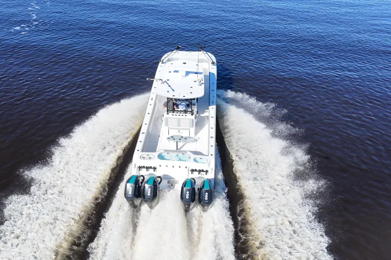 Slide: The Image of 2024 Front Runner 37 Catamaran cruising on open water, rear view. - 68