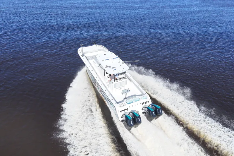 Slide: The Image of 2024 Front Runner 37 Catamaran cruising on open water, aerial view. - 69