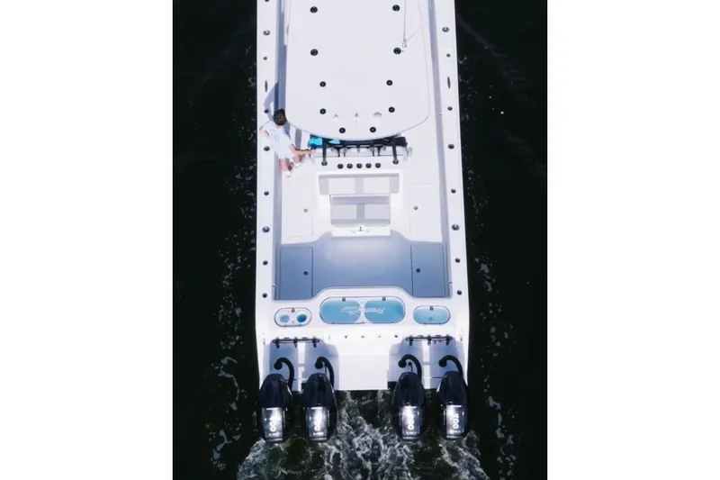 Slide: The Image of 2024 Front Runner 37 Catamaran cruising on open water, showcasing sleek design and powerful engines. - 7