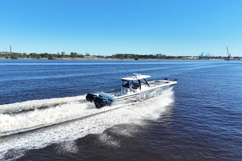 Slide: The Image of 2024 Front Runner 37 Catamaran cruising on a sunny day, showcasing sleek design and powerful engines. - 71