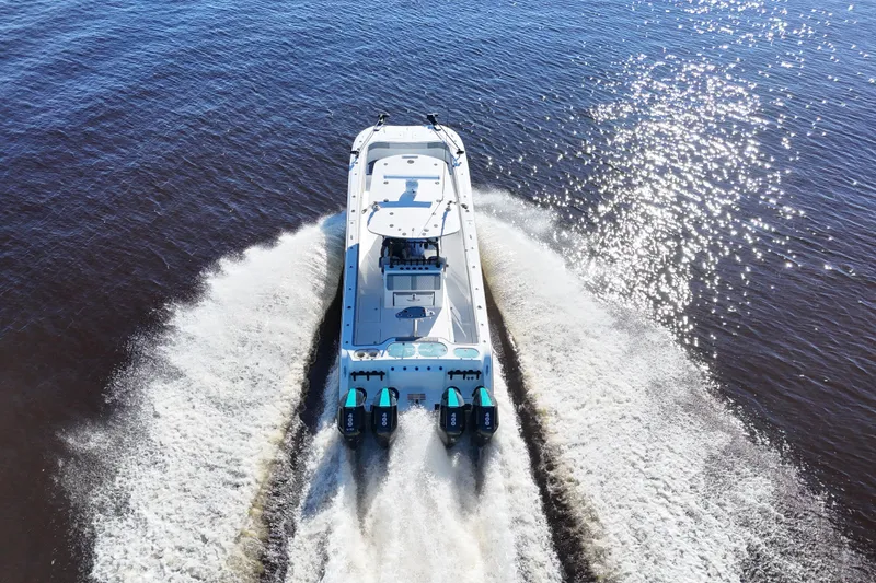 Slide: The Image of 2024 Front Runner 37 Catamaran cruising on open water, aerial view. - 72