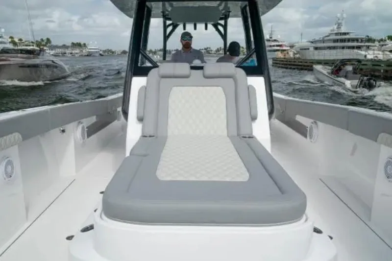 Slide: The Image of 2024 Front Runner 37 Catamaran with spacious deck and luxurious seating on the water. - 83