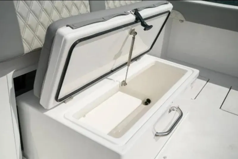 Slide: The Image of Open storage compartment on 2024 Front Runner 37 Catamaran boat interior. - 93